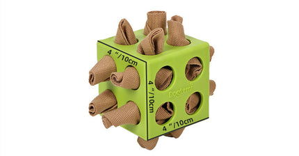 Green square block with brown cylindrical protrusions on a white background