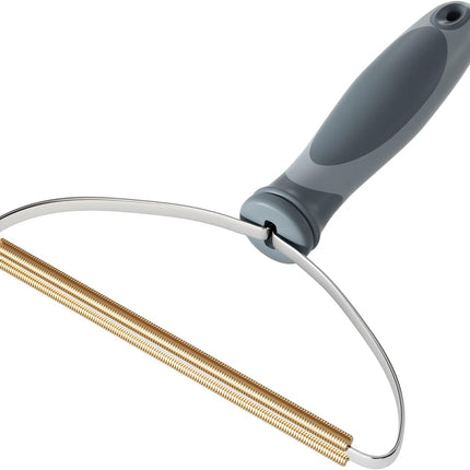 Cleaning brush with a gray handle and gold bristle head on a white background