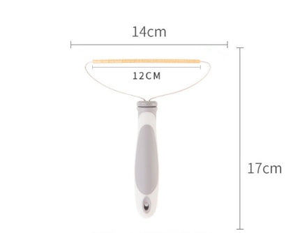 Measurement chart of a grooming tool with dimensions labeled.