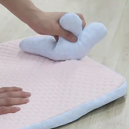 Dog relaxing on cooling pet mat